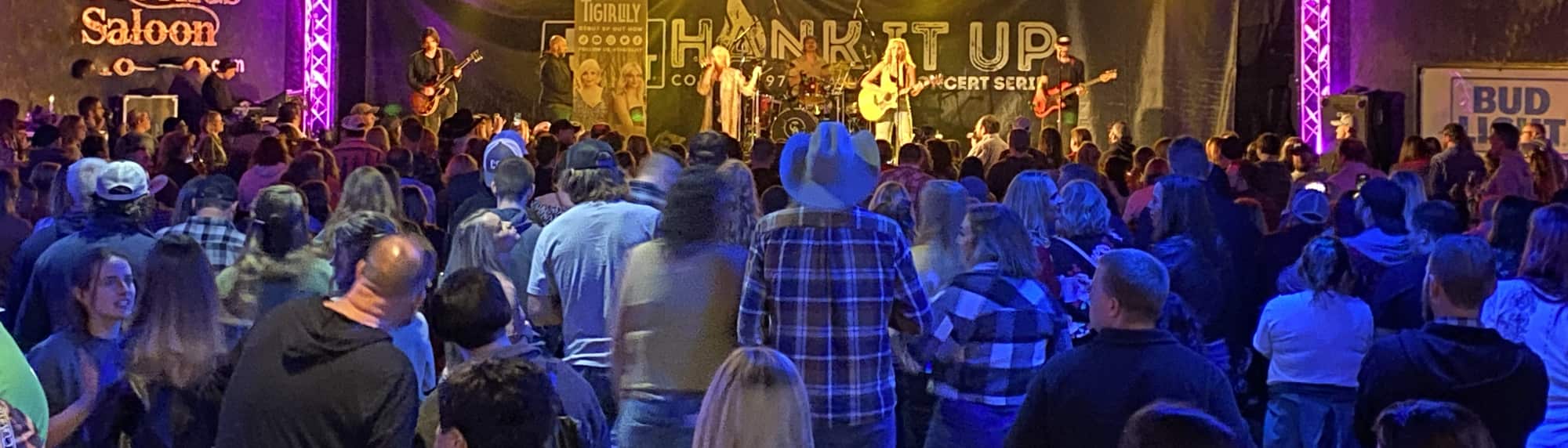 country concert with fans wearing cowboy hats Charlottesville