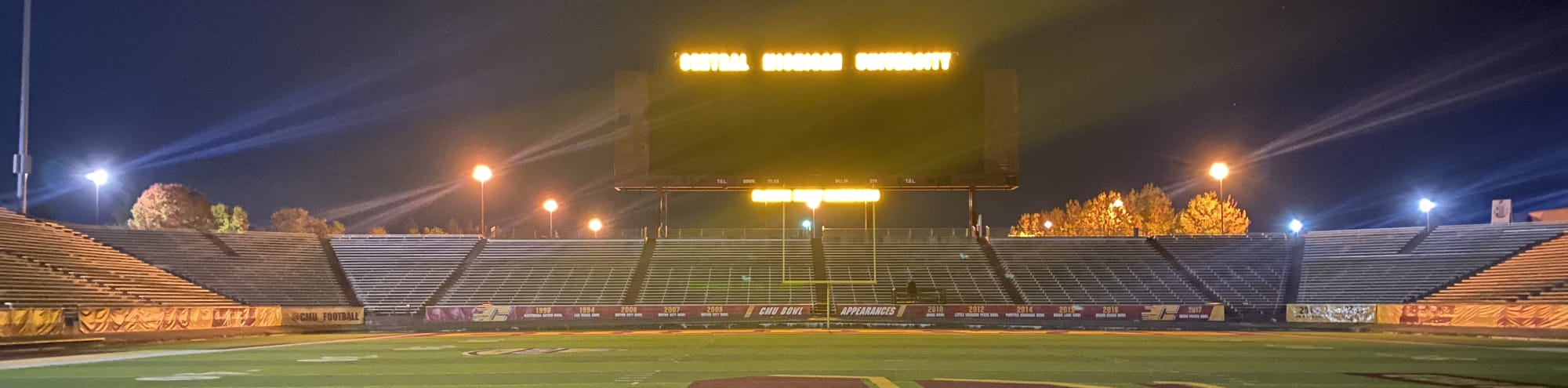 empty football stadium at night under the lights Charlottesville
