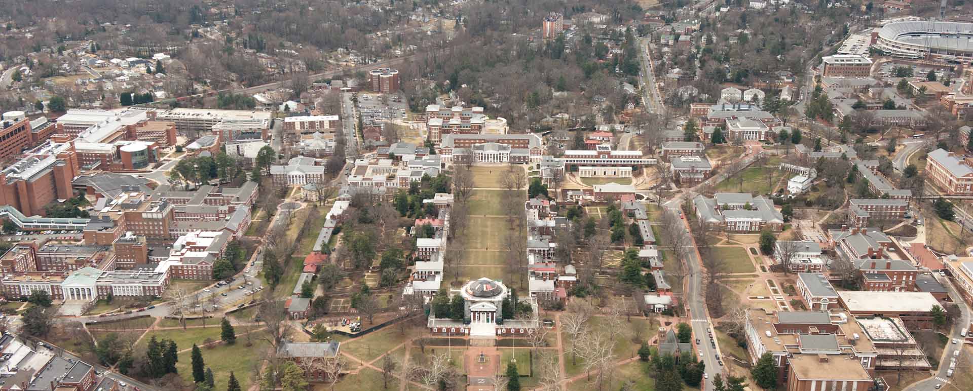 Neon color image of a band playing and people singing along