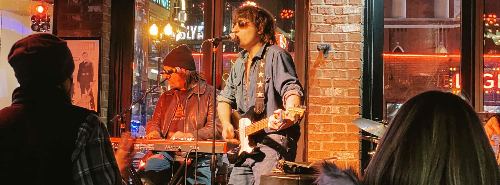 bar singer on guitar in Charlottesville